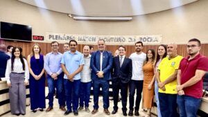 Equipe de colaboradores com o presidente